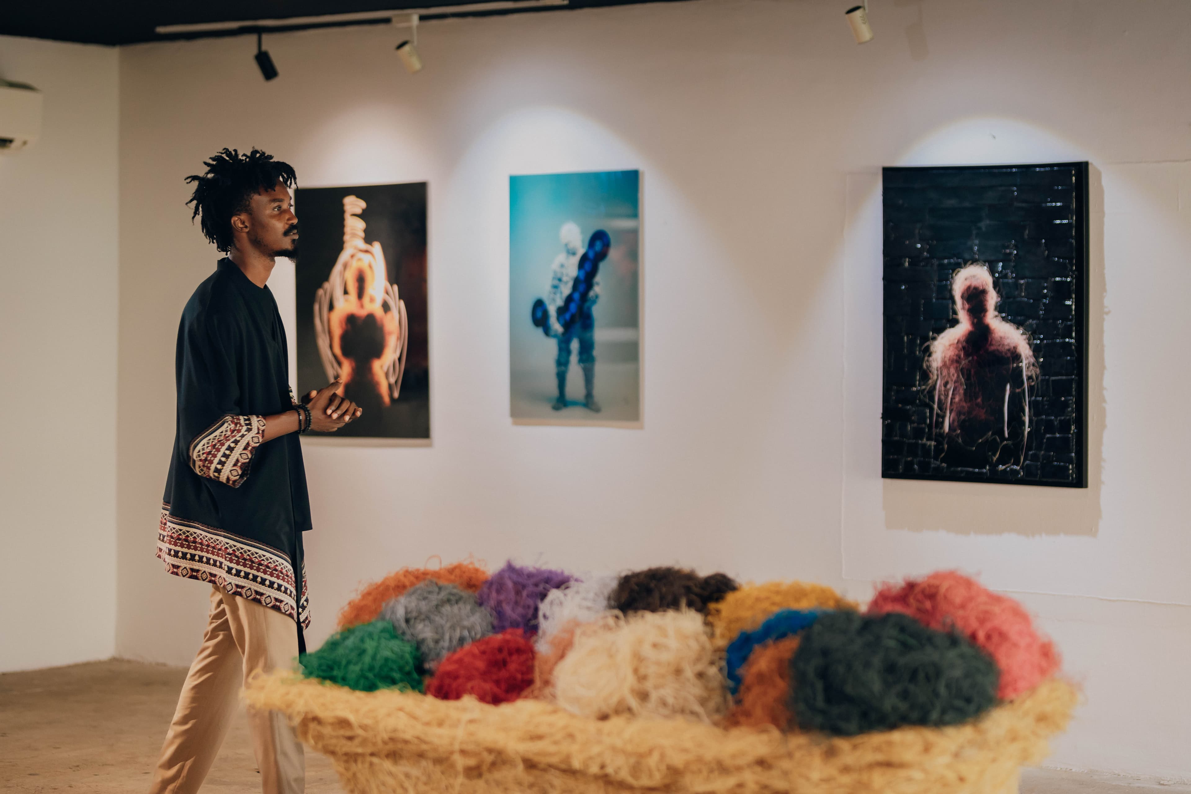 Art gallery exhibition with colorful textile displays